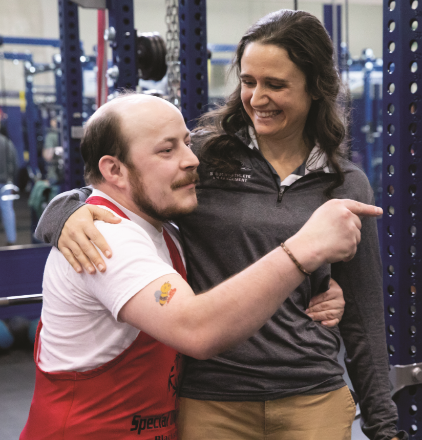 Longwood athletic trainer Morgan Langton shows her support to a meet participant.