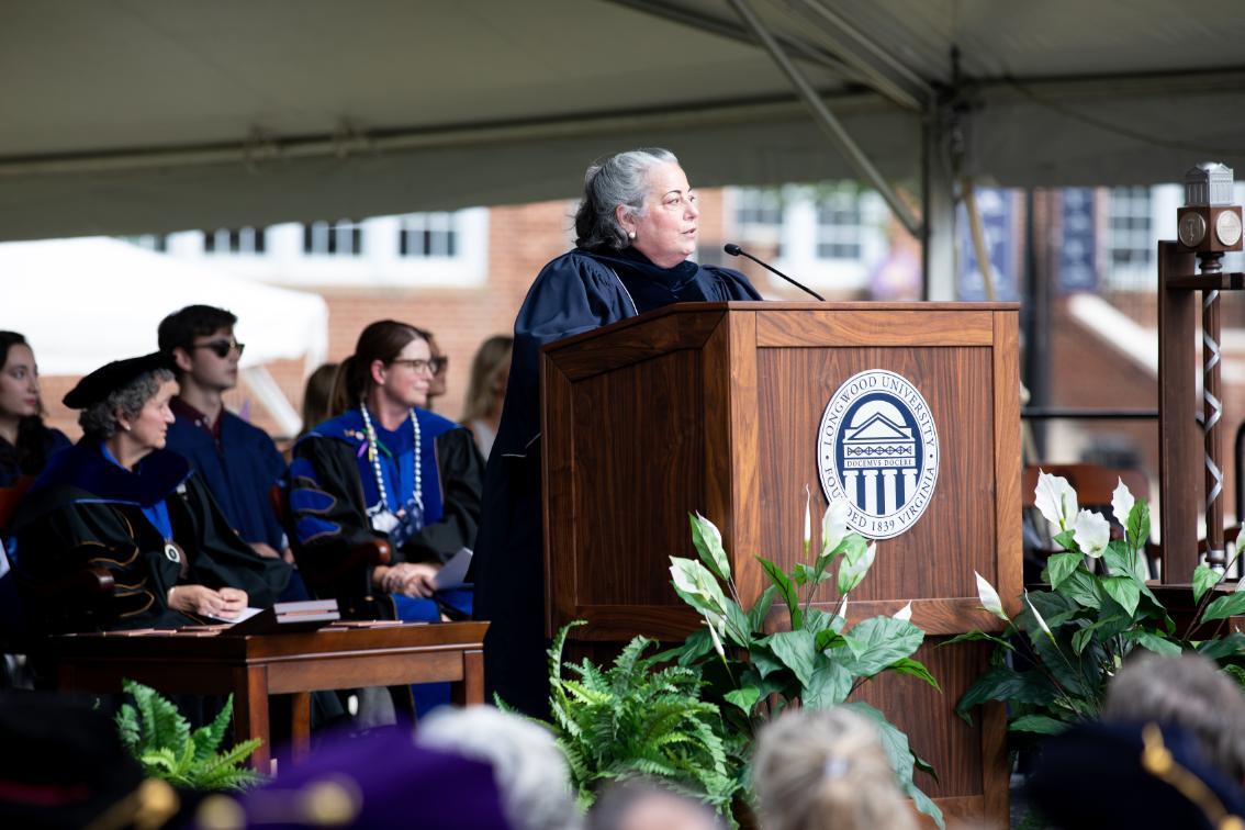 Pia Trigiani, rector of the Longwood Board of Visitors, addresses seniors.