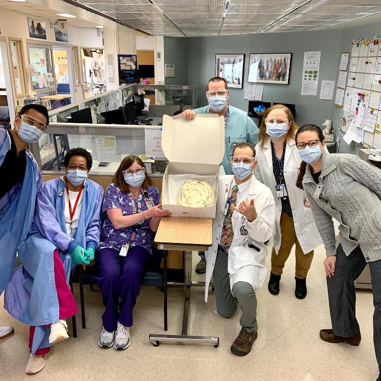 Medical staff receiving a giant cinnamon roll